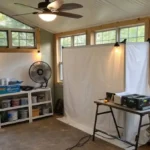 DIY ventilation for spray paint setup in a cozy home workspace.